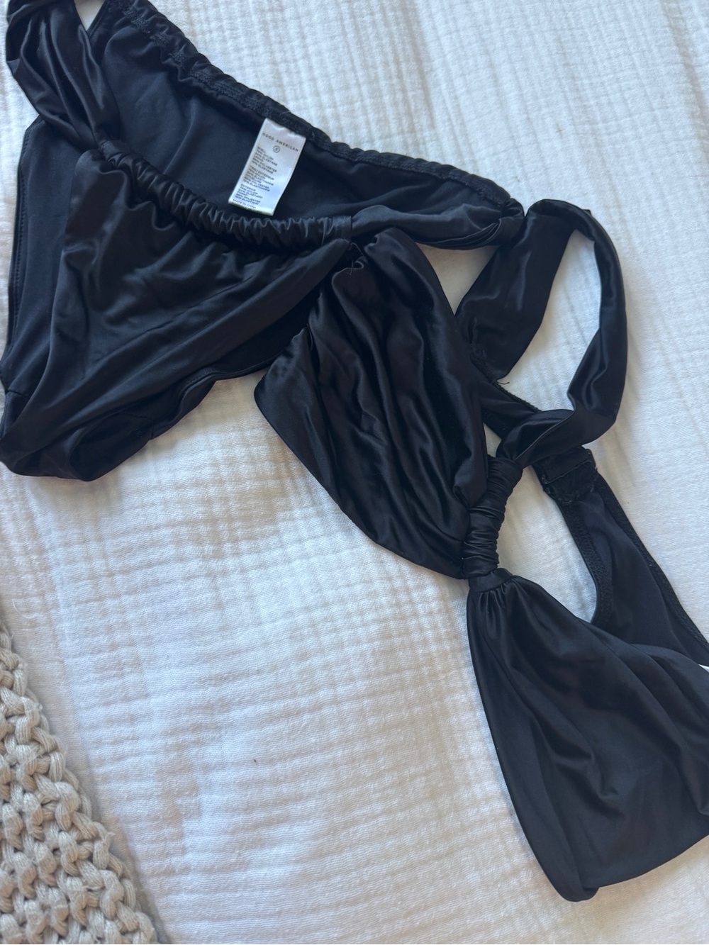 Good American black satin one shoulder bikini set